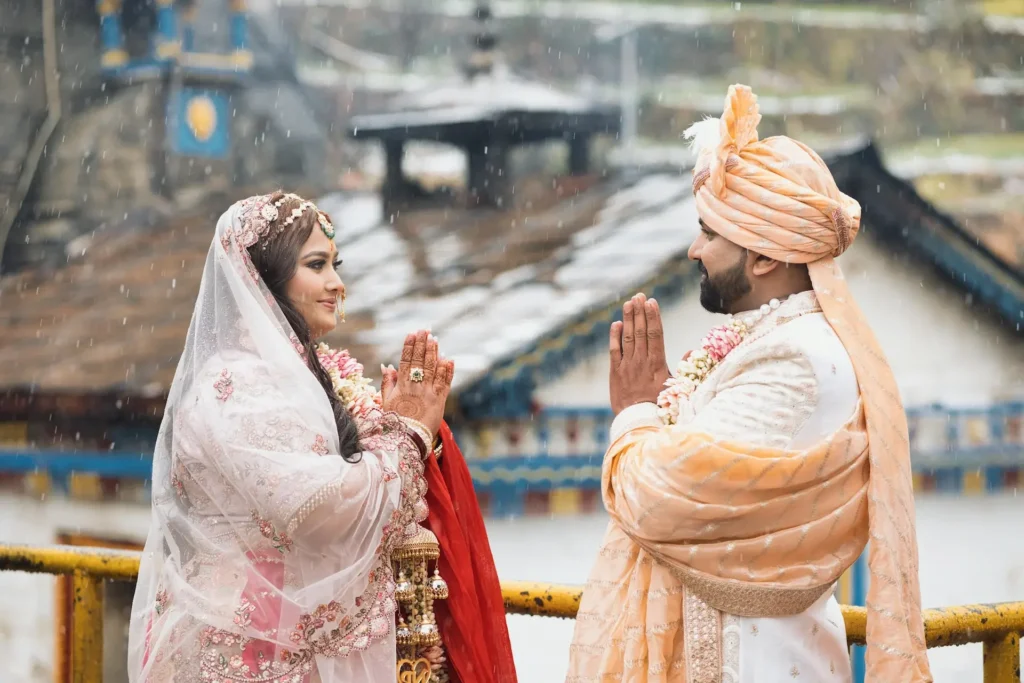 Bride sharing a joyful moment with a loved one during the colorful Haldi celebration.