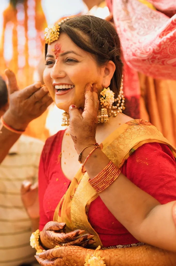 Joyful haldi ceremony moment filled with laughter and family traditions