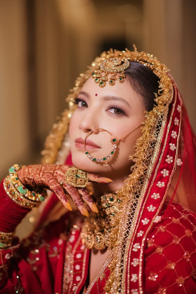 Close-up bridal portrait highlighting intricate jewellery, makeup and wedding details