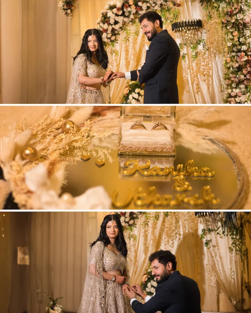 Couple exchanging rings during their engagement ceremony with elegant floral décor in the background.