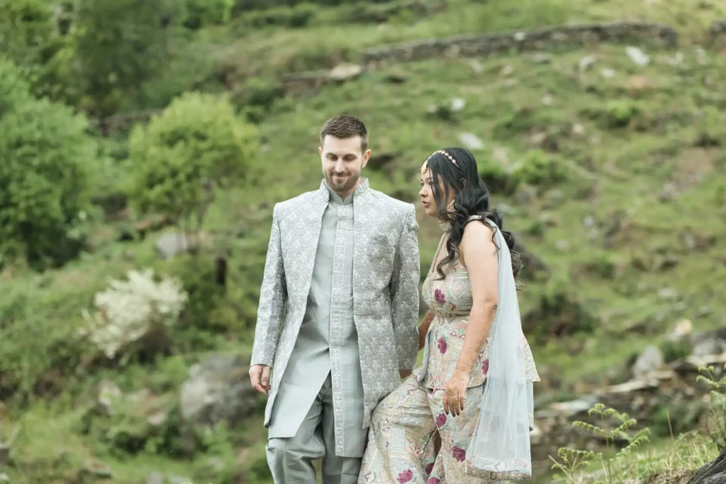 Candid couple walk captured during Destination Weddings amidst the natural beauty of Uttarakhand