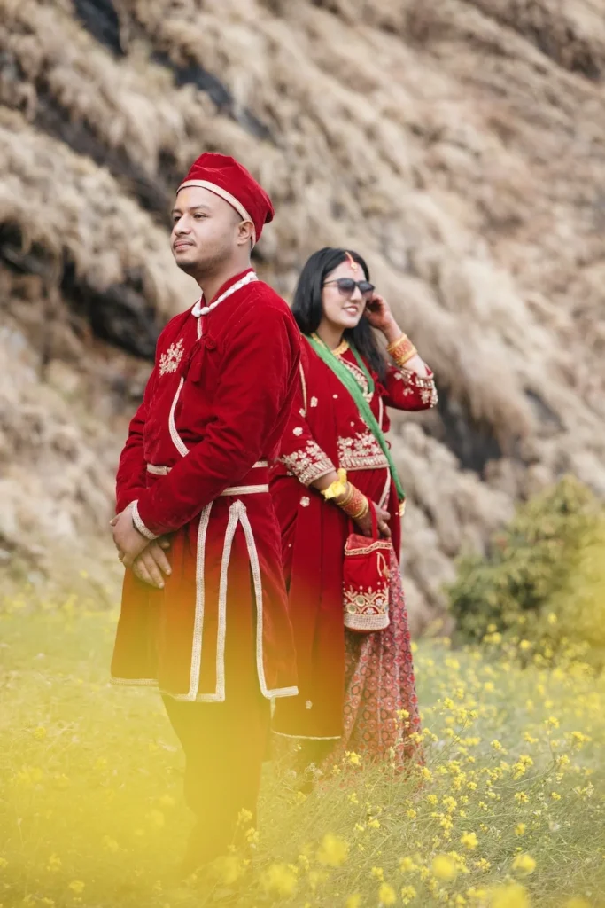 Destination Weddings couple portrait in traditional Uttarakhand attire against scenic mountain landscapes