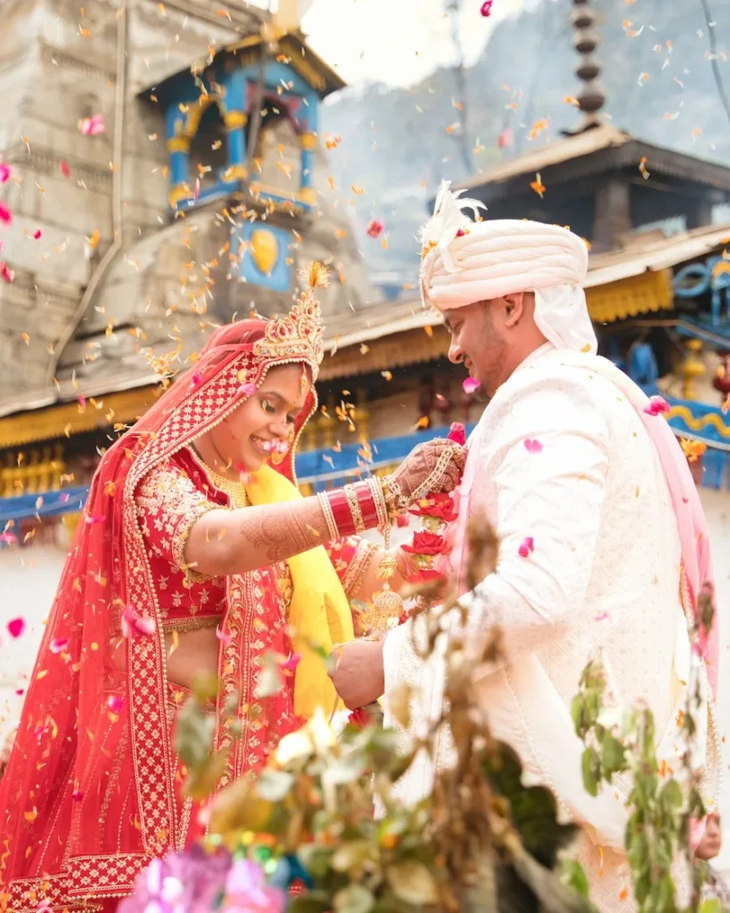 Flower shower moment during a traditional Destination Weddings celebration in Uttarakhand