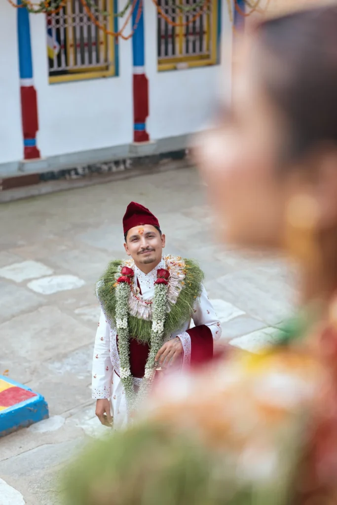 Groom admiring his bride during a Ukhimath wedding ceremony at Omkareshwar Temple in Uttarakhand.
