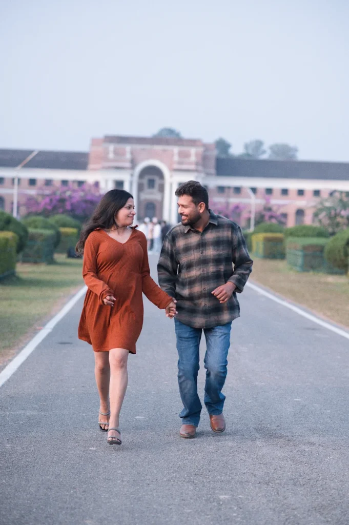 Couple walking together during the best time for pre-wedding shoot in Dehradun with a scenic heritage backdrop