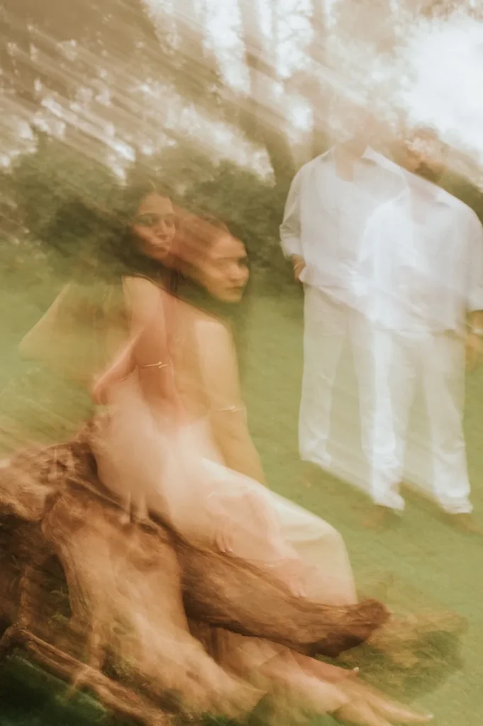 Creative motion blur pre wedding photography capturing an artistic and cinematic couple portrait in a natural outdoor setting.