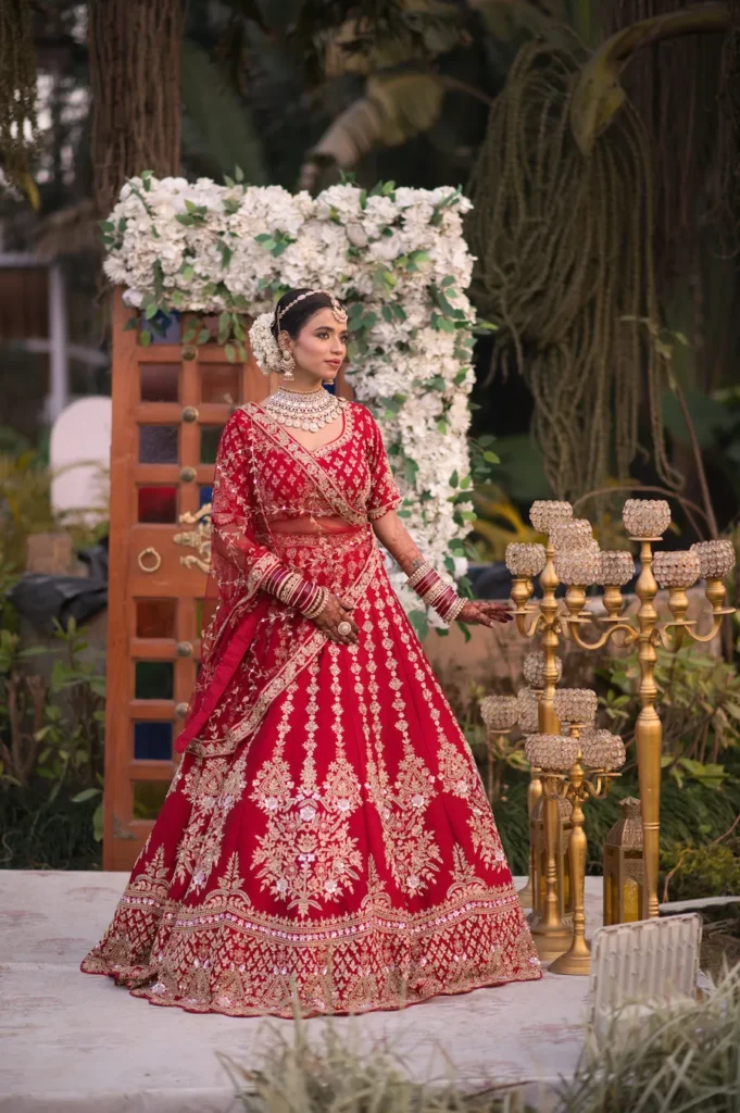 Bride getting Married in Dehradun wearing a traditional red lehenga at a beautiful wedding venue