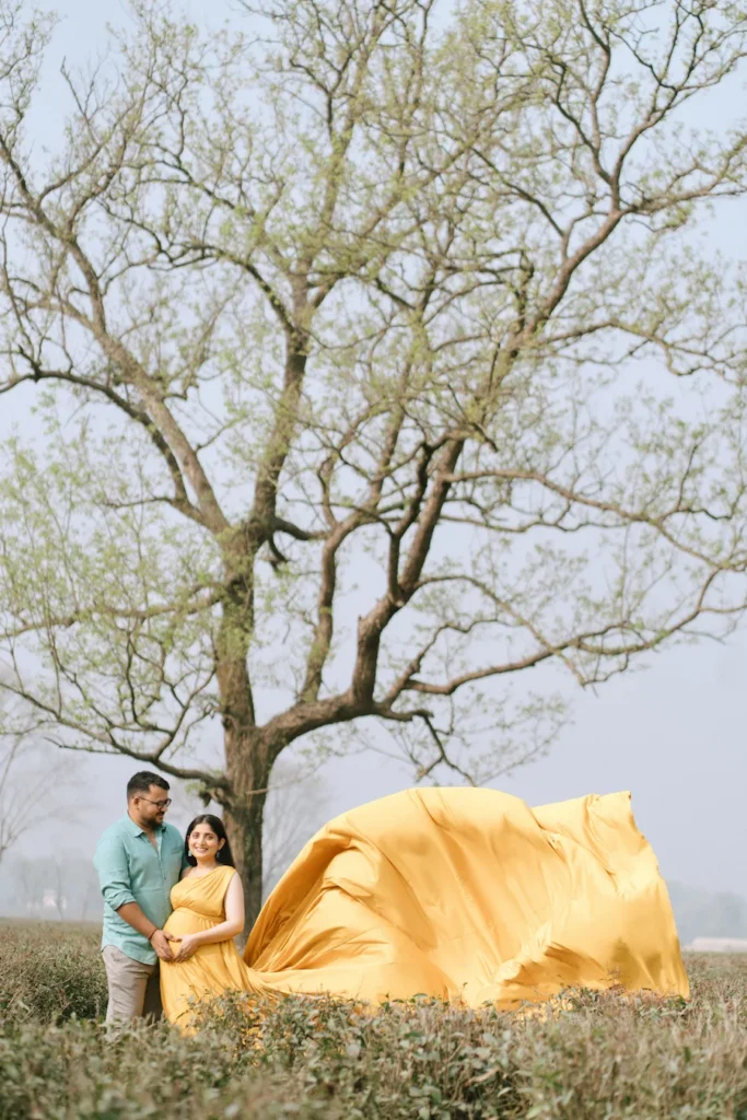 Creative maternity photoshoot featuring an expecting mother in nature
