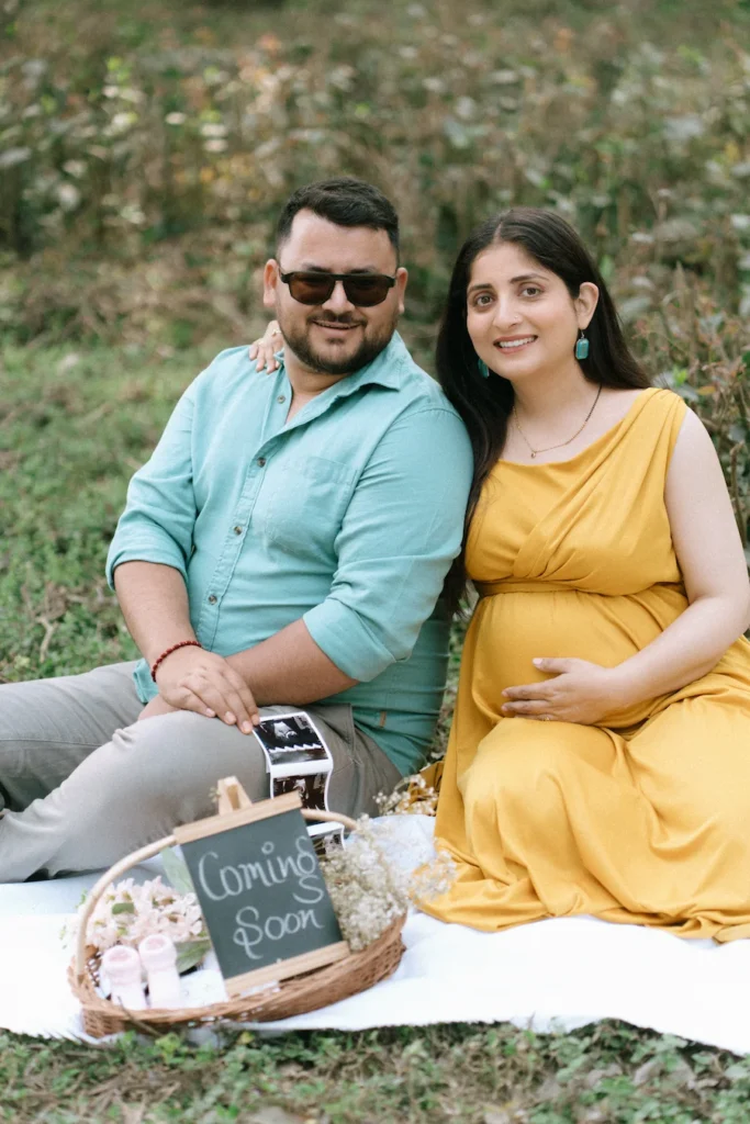 Expecting parents enjoying a candid outdoor maternity photography session