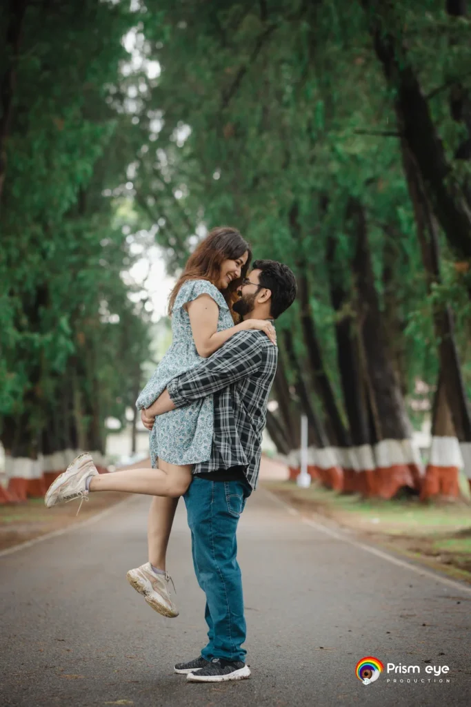 Romantic pre-wedding couple pose on a scenic forest road during the best time for pre-wedding shoot in Dehradun