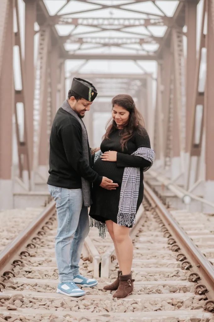 Expecting parents sharing a heartfelt moment during a maternity session