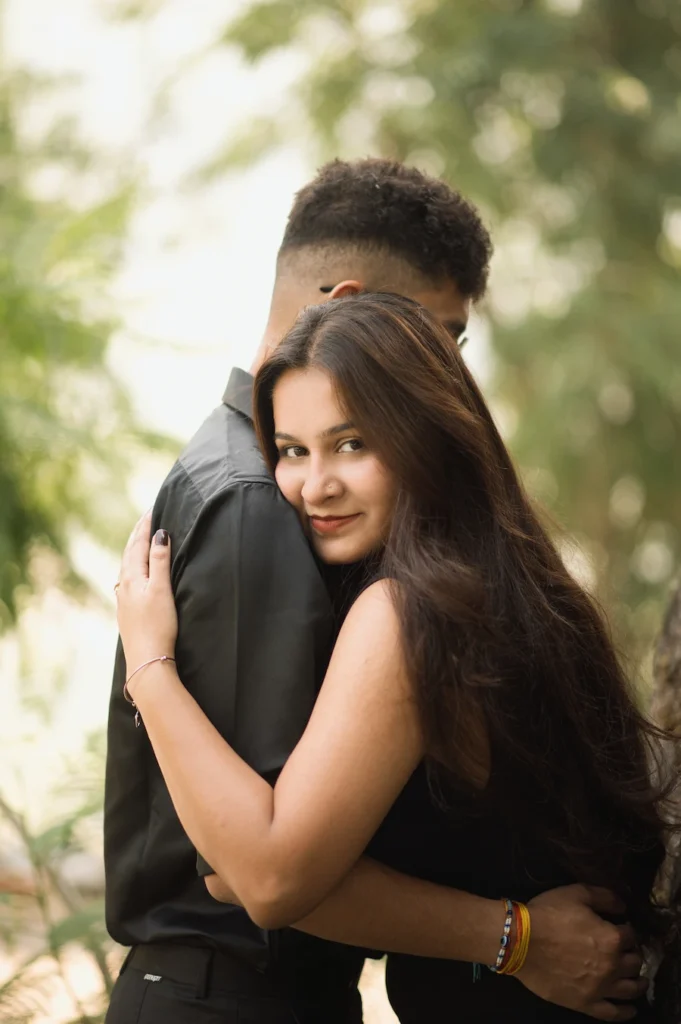 Romantic couple embrace captured during the best time for pre-wedding shoot in Dehradun's scenic outdoors
