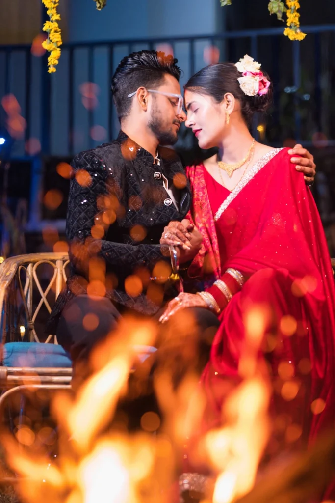 Bride and groom sharing a romantic moment beside a wedding bonfire