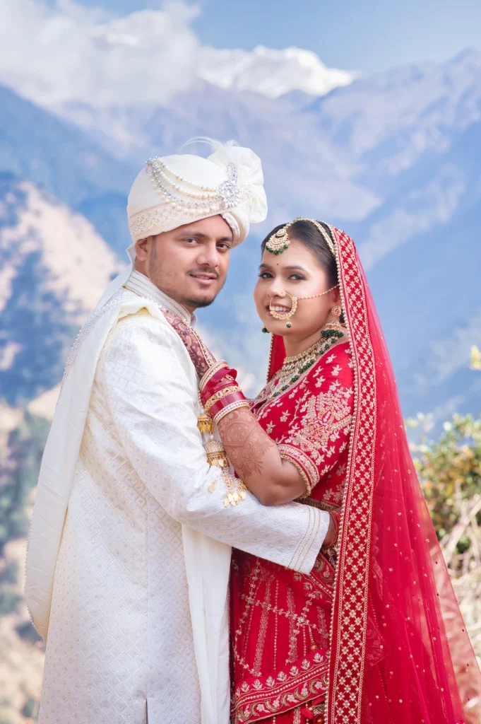 Newlywed couple embracing during an outdoor wedding portrait with scenic mountain views