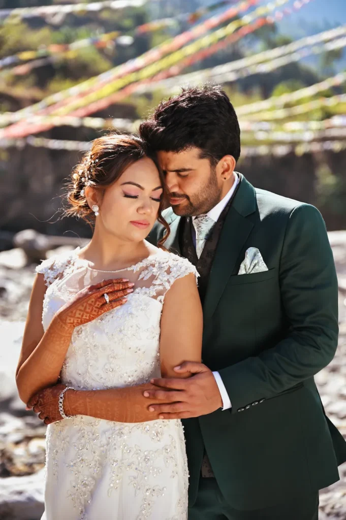 Elegant wedding portrait of bride and groom captured in natural mountain light
