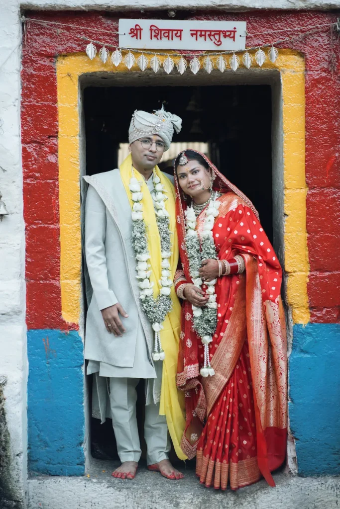 Newlywed couple portrait captured at a sacred temple wedding