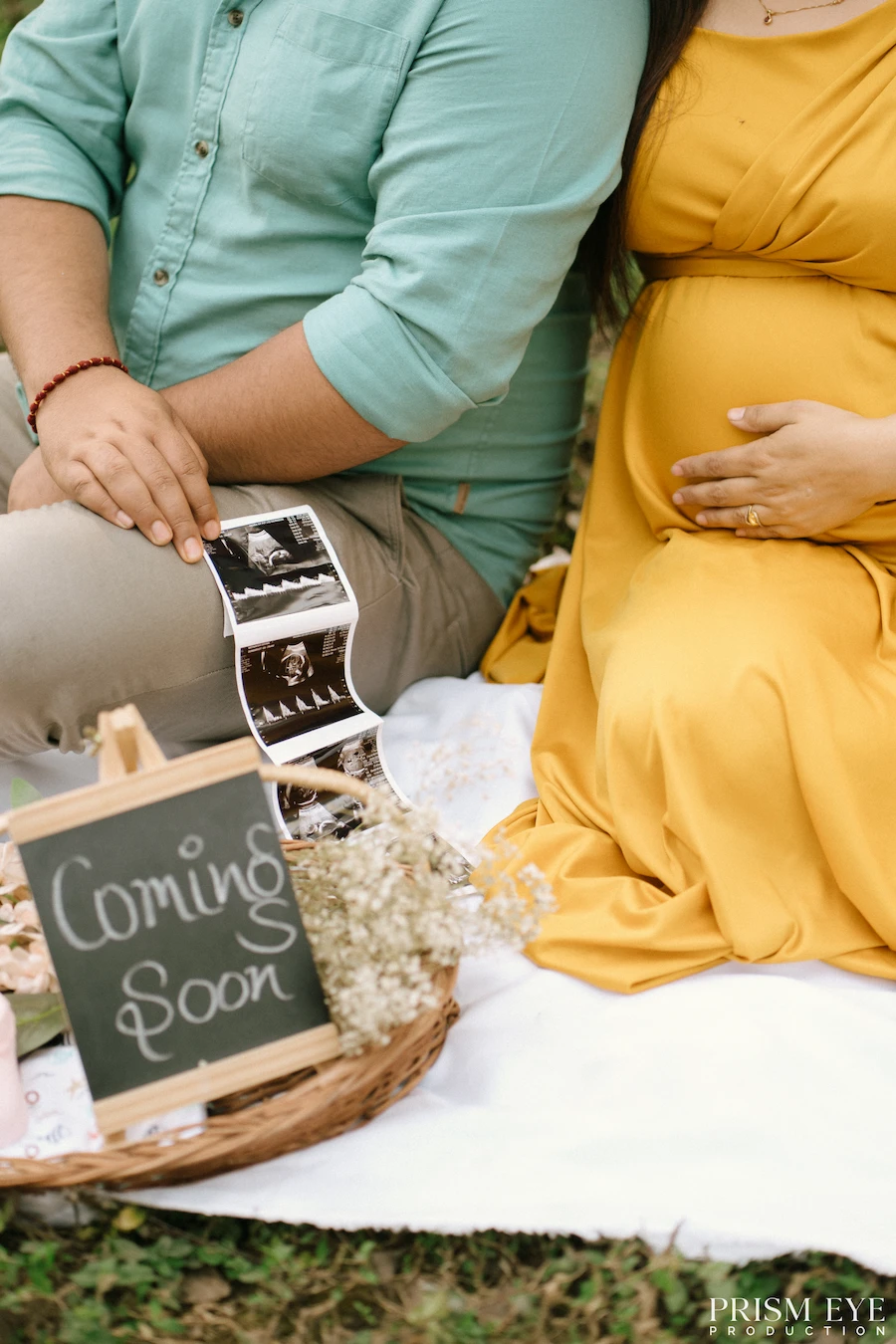 A beautiful little announcement before the sweetest chapter begins. Maternity announcement photo of expecting parents with ultrasound pictures and a coming soon sign