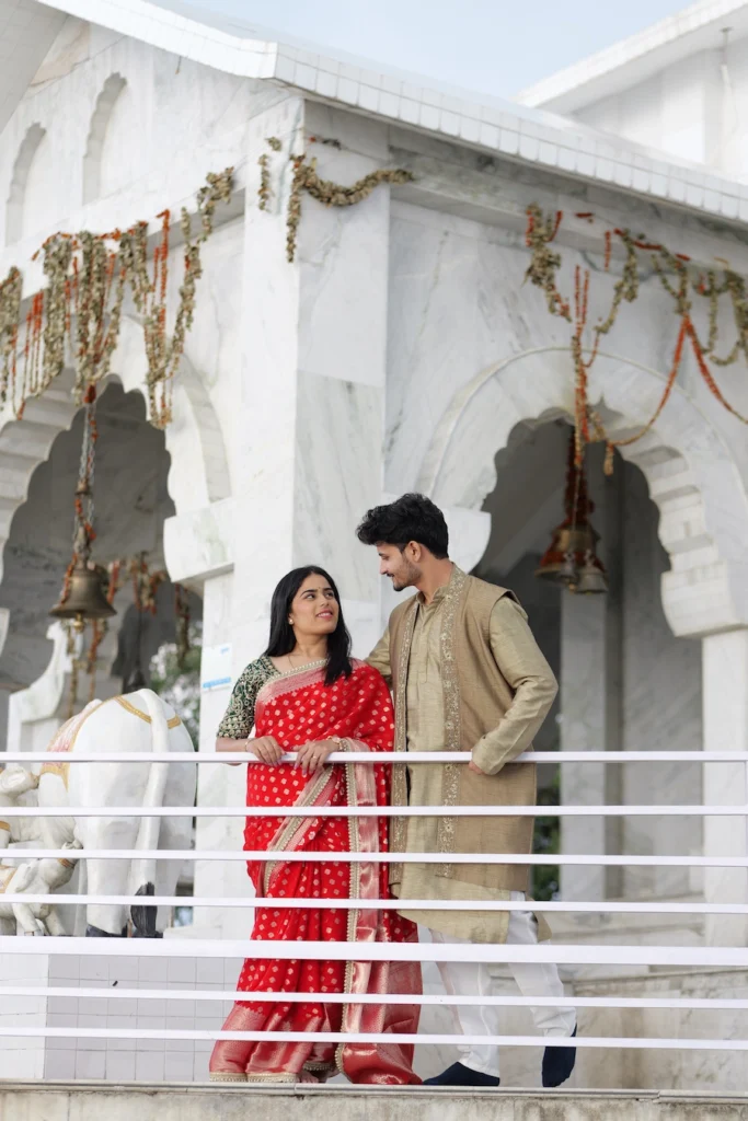 Couple posing at Bhadraj Temple during a traditional pre-wedding shoot in Mussoorie