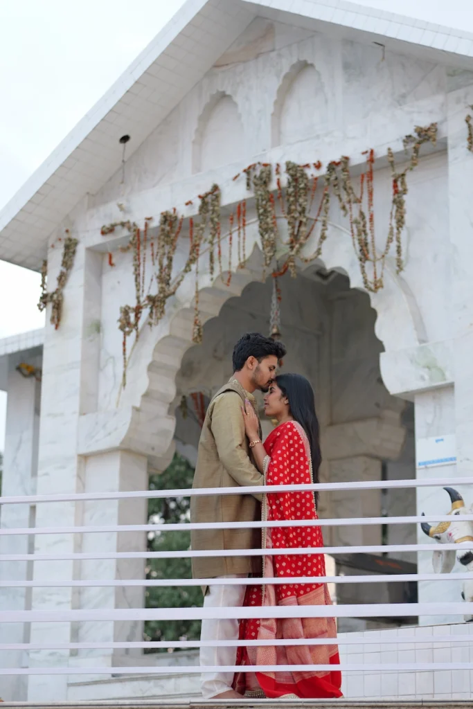 Romantic couple portrait at Bhadraj Temple featuring traditional attire and temple architecture