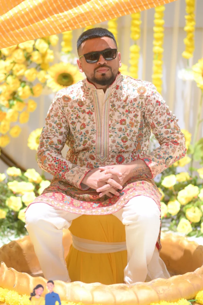 Stylish groom portrait during haldi ceremony at destination wedding in Rishikesh