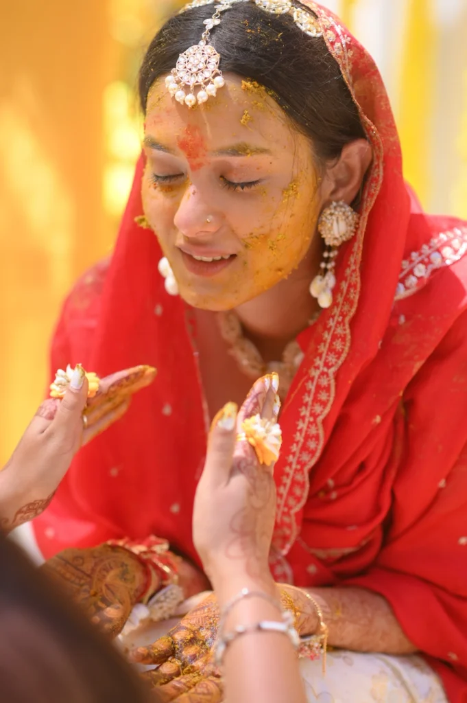 Beautiful bride during joyful haldi ceremony captured in Rishikesh wedding 