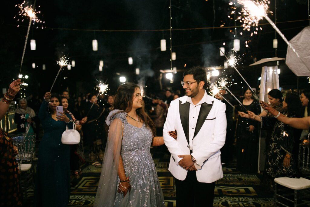 Bride and groom making a grand reception entry at one of the best destination wedding venues in Dehradun