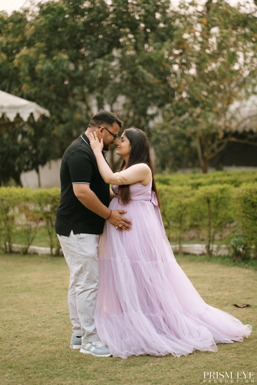 Together, waiting for the little love that will soon make three. Expecting couple sharing a romantic maternity moment outdoors in Lachhiwala