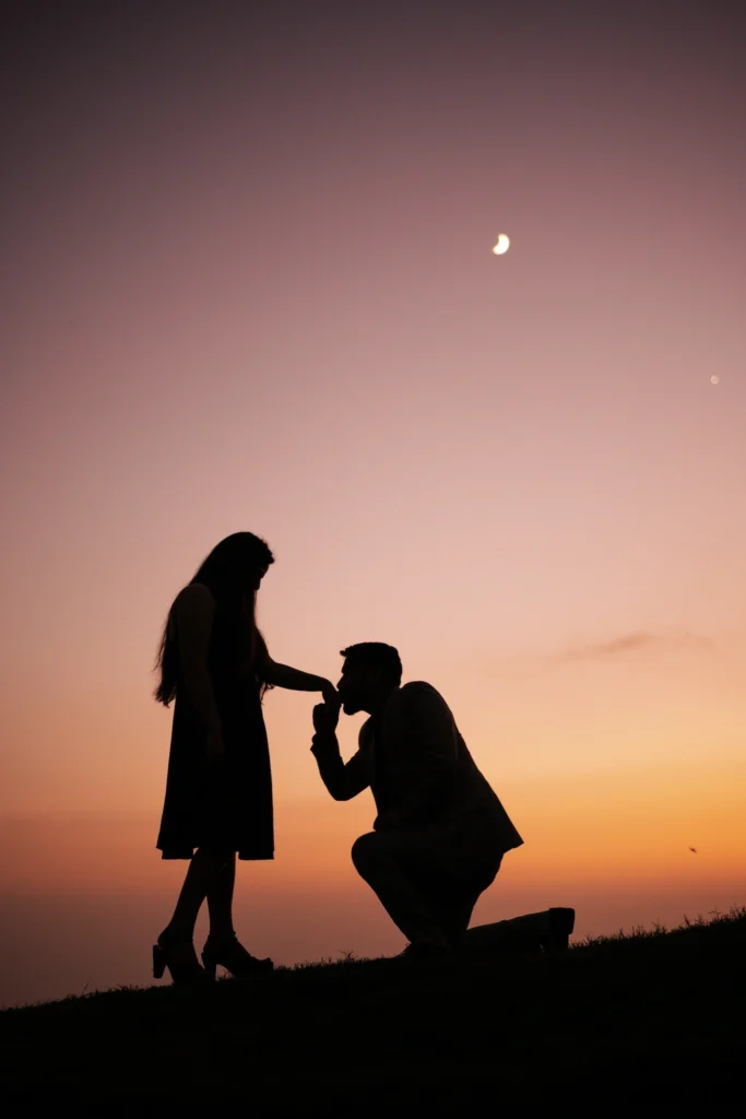Silhouette of a couple during a sunset proposal at Lal Tibba, sharing a romantic pre-wedding moment beneath the evening sky.