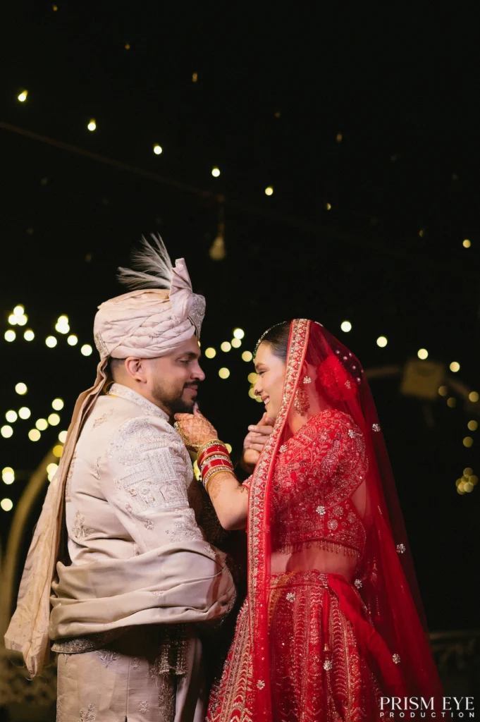 Romantic bride and groom portrait under decorative lights at Rishikesh destination wedding