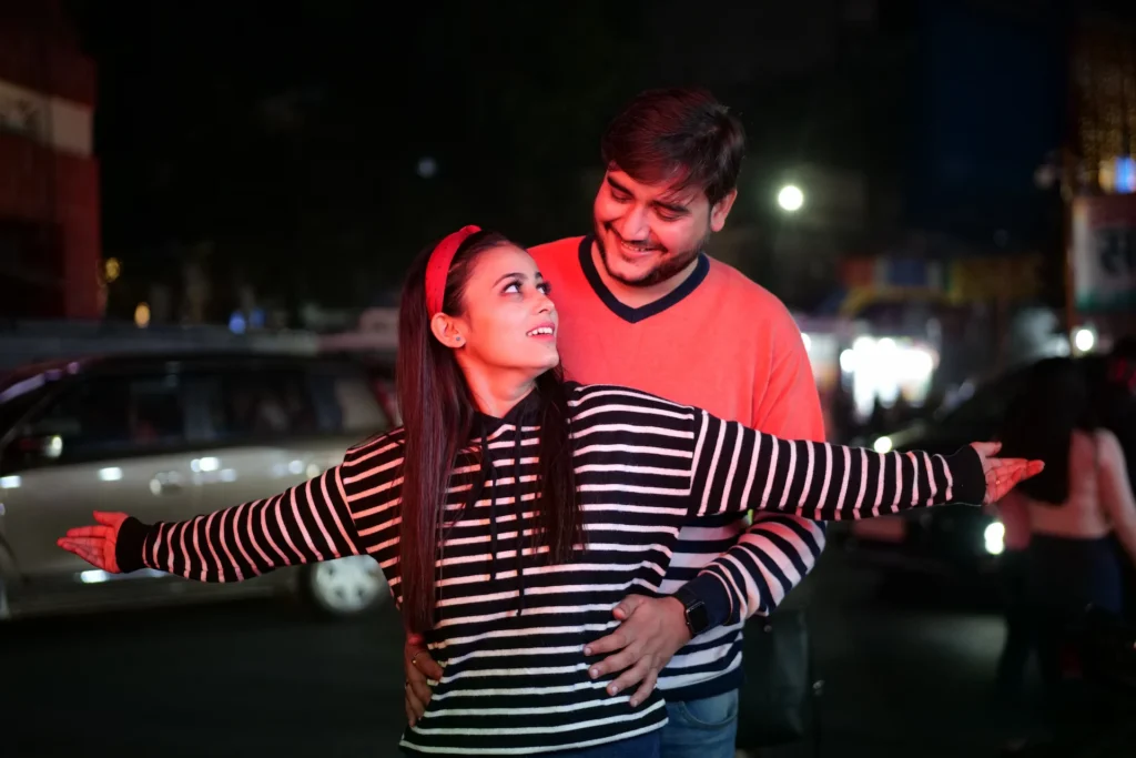 Romantic close-up portrait of a couple captured on Mussoorie Mall Road at night