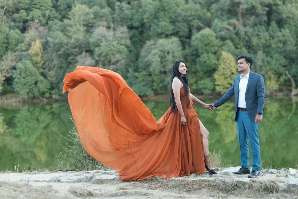 Romantic pre-wedding shoot at Mussoorie Lake with a couple posing beside the scenic waterfront