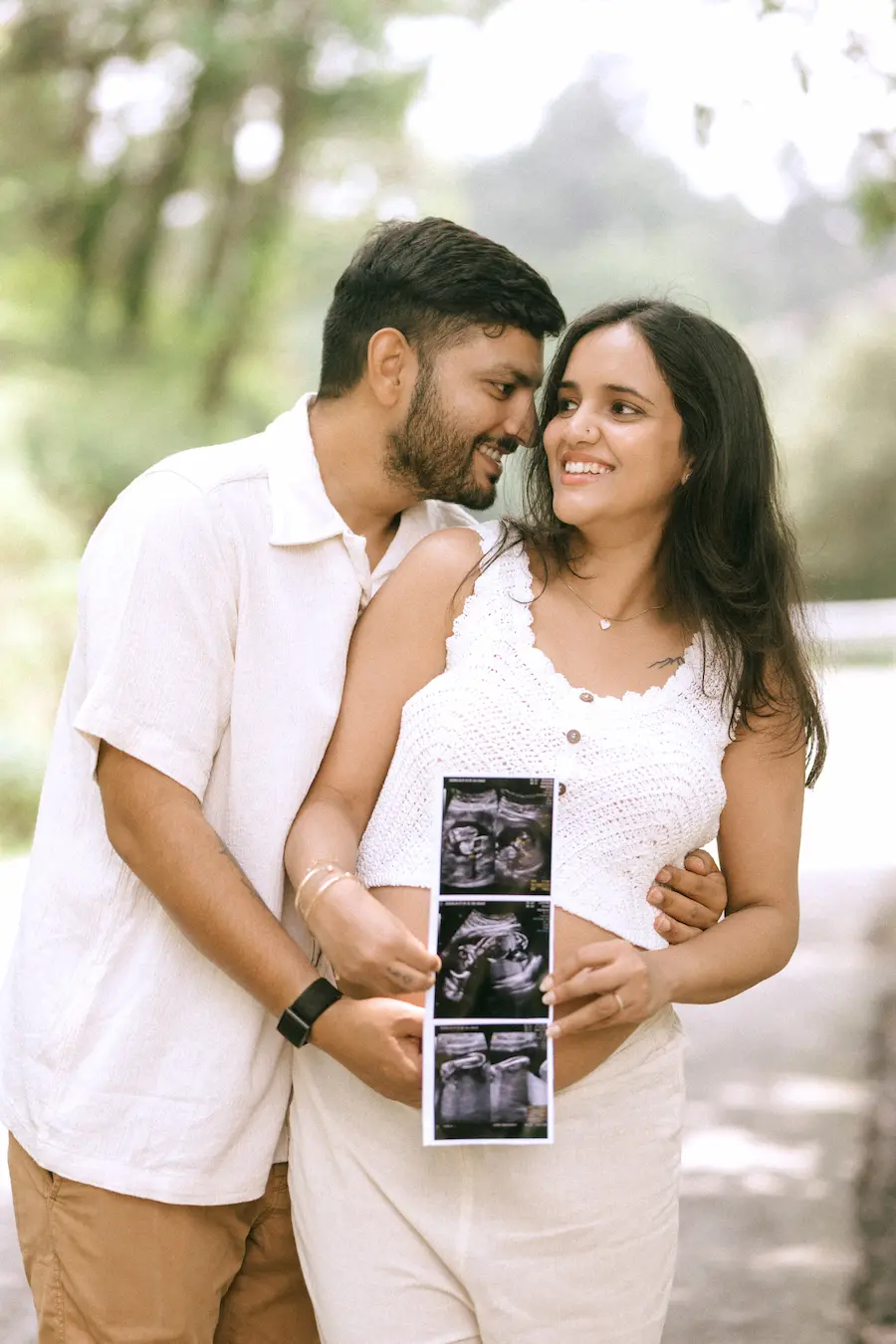 A beautiful little reminder that their greatest adventure is just beginning. Expecting couple holding ultrasound photos during a maternity photoshoot on Rajpur Road