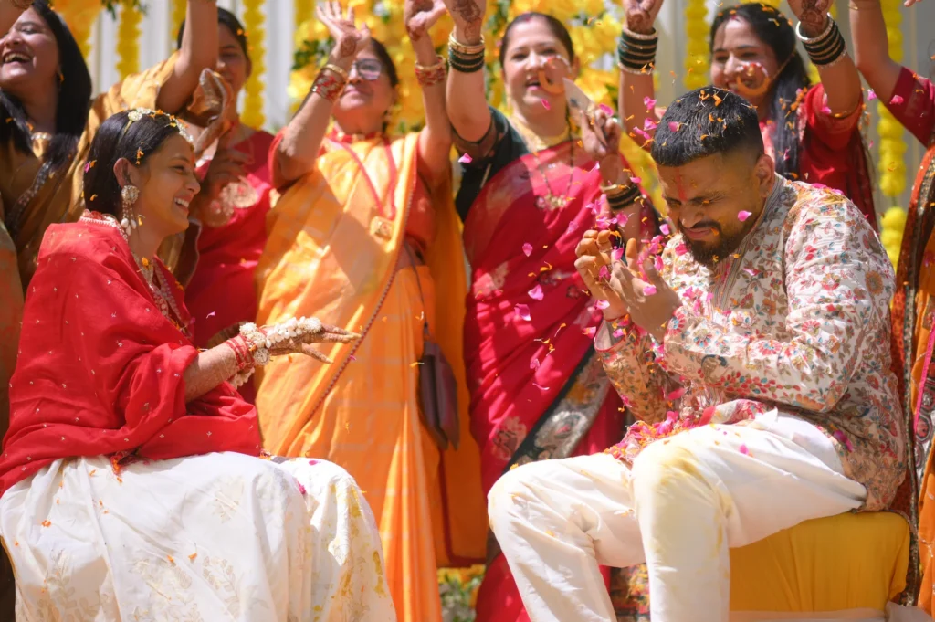 Joyful haldi ceremony celebration in Rishikesh with candid bride and groom moments captured during a luxury destination wedding by Prism Eye Productions