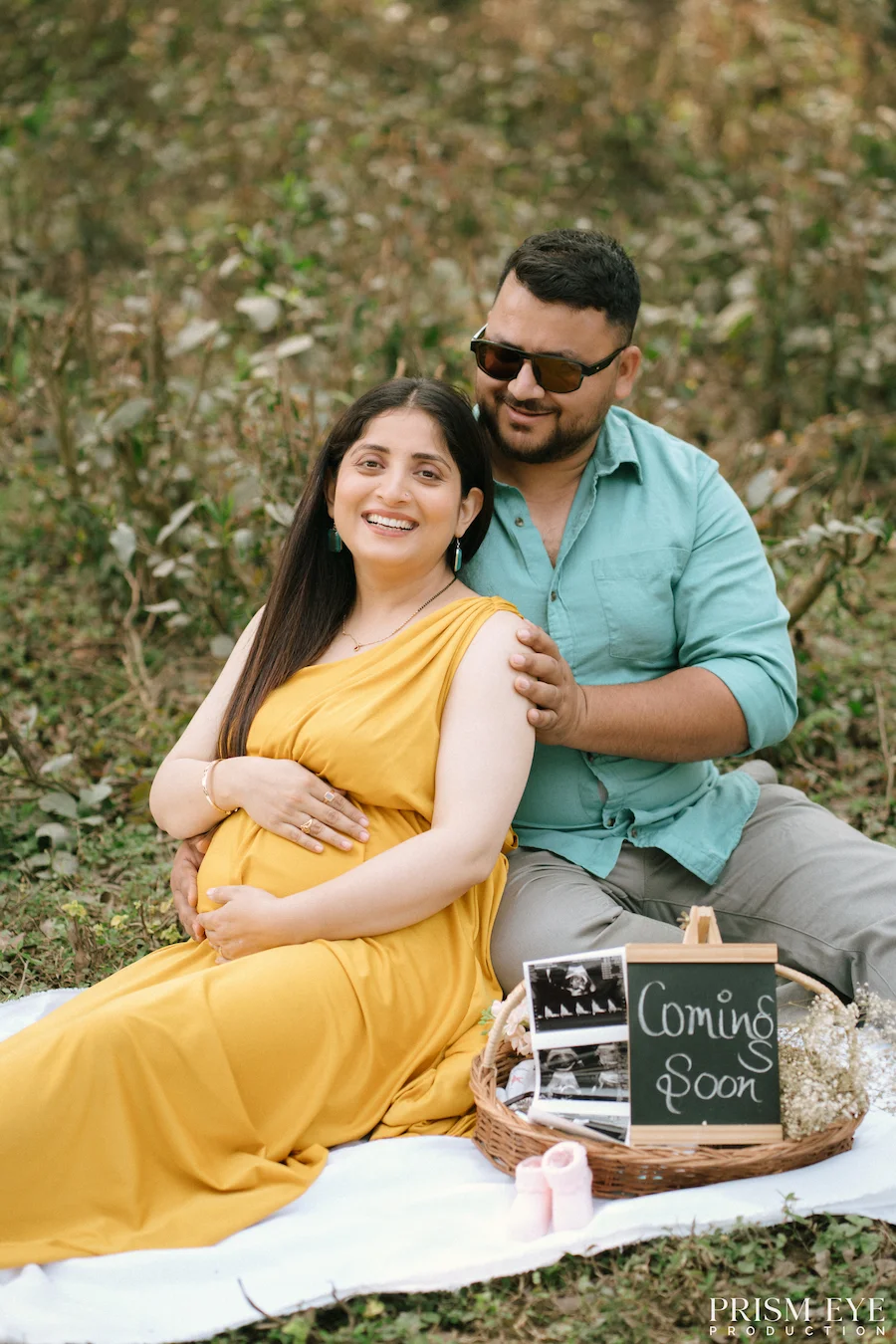 A little “Coming Soon” moment filled with love, laughter, and anticipation. Expecting couple enjoying a maternity picnic at Shastradhara with ultrasound photos