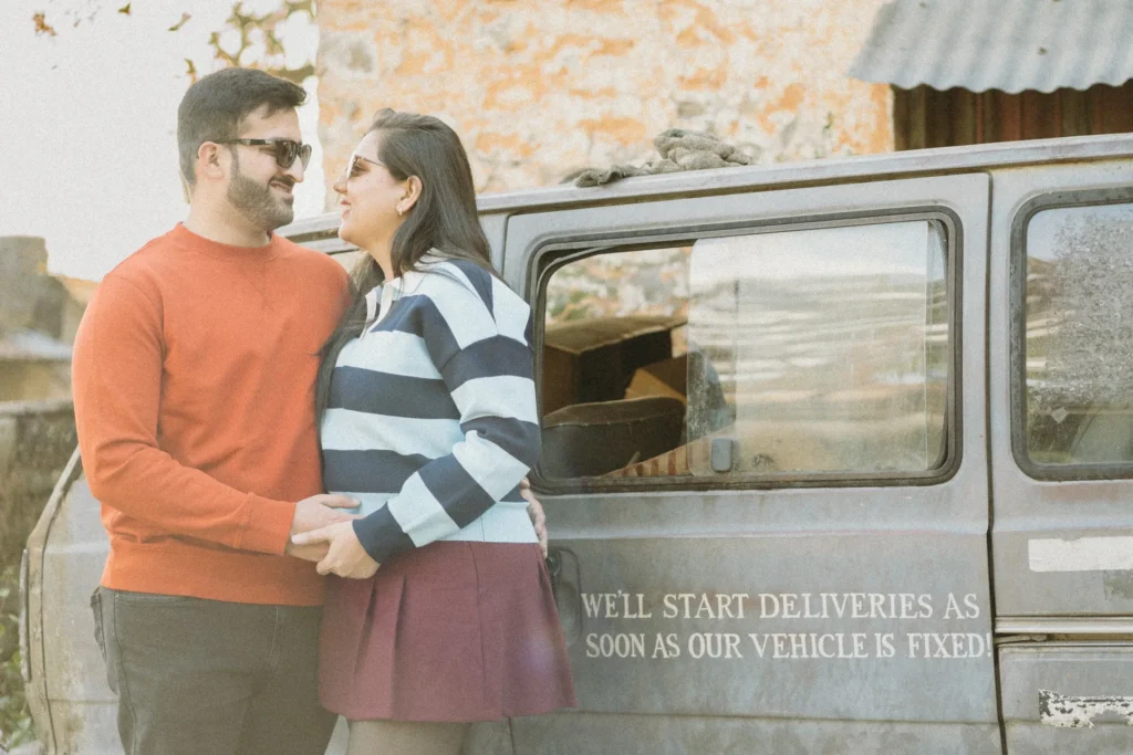 Romantic pre-wedding shoot at Lal Tibba Mussoorie featuring a couple posing beside a vintage jeep