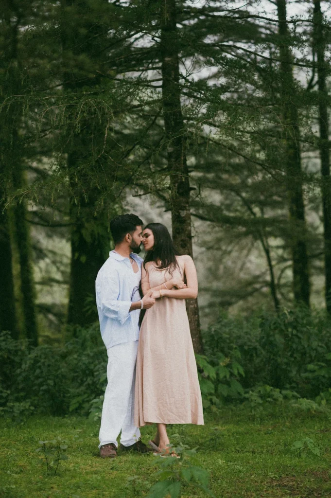 Couple embracing among pine trees at one of the best pre-wedding shoot locations in Mussoorie