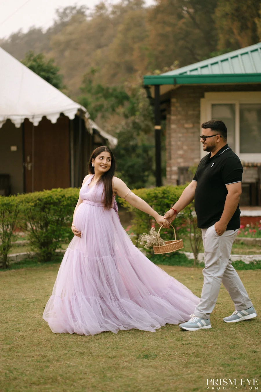 Walking together into a beautiful new chapter of life. Expecting couple walking hand in hand during an outdoor maternity photoshoot
