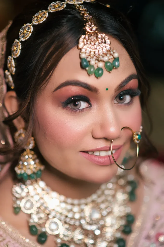Close-up portrait showcasing elegant bridal jewelry, makeup, and traditional wedding details