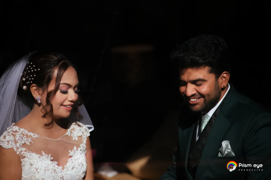 Christian-Hindu Wedding couple sharing a candid conversation during their wedding celebration