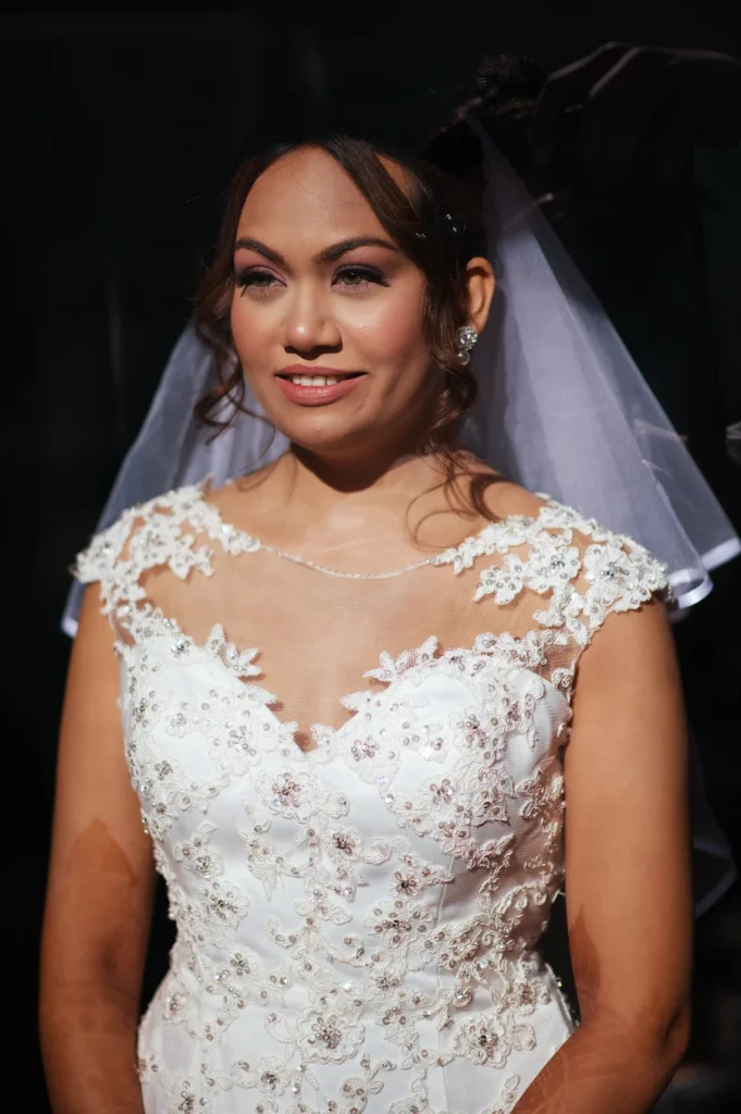 Elegant bridal portrait featuring soft natural light, a flowing veil, and timeless wedding styling