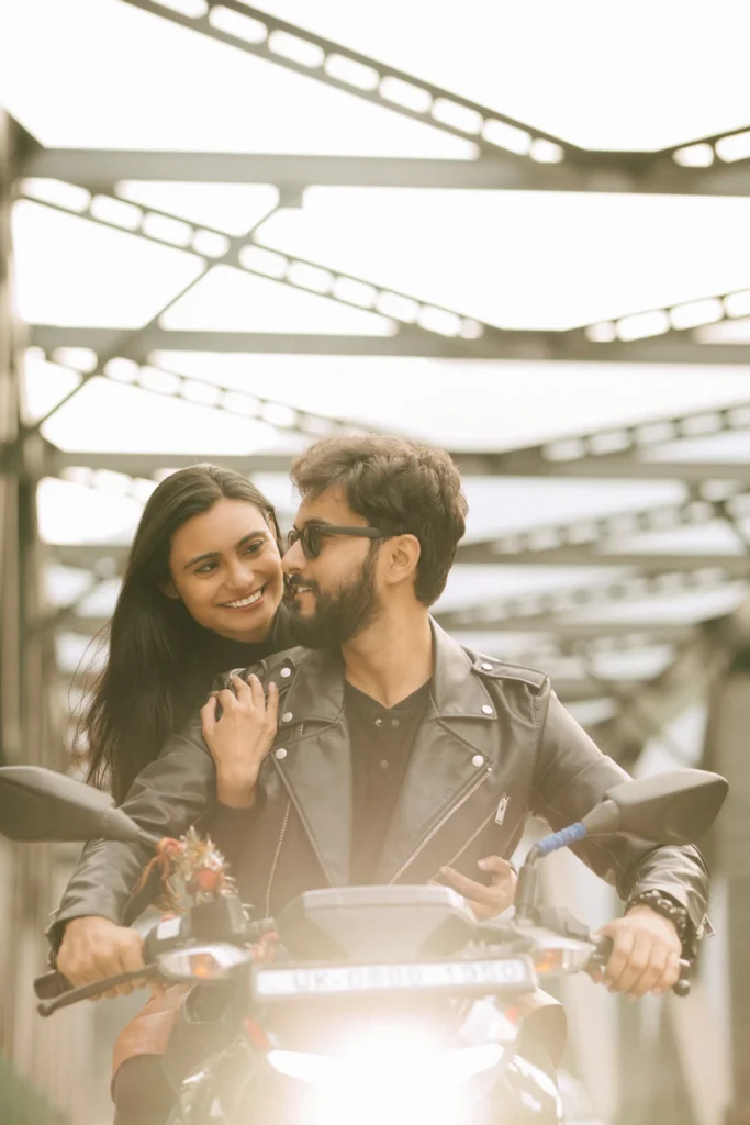 Couple enjoying a candid bike ride during a Rishikesh pre-wedding shoot