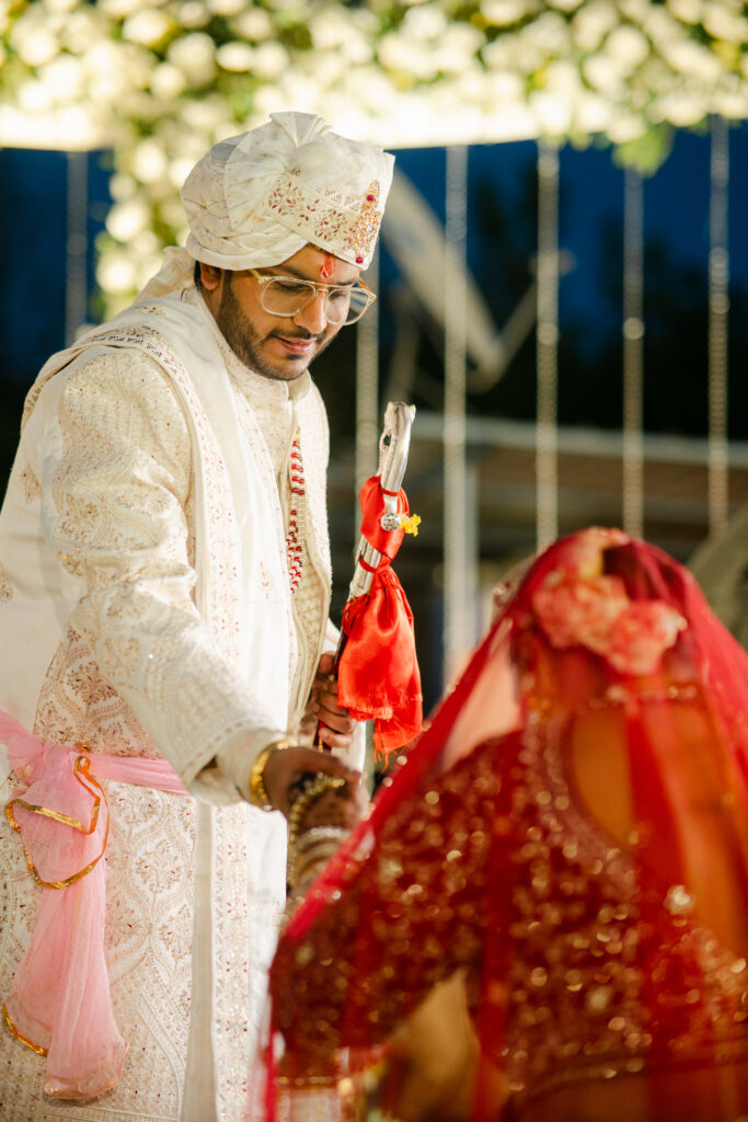 Bride and groom sharing candid wedding moments during a luxury wedding in Dehradun