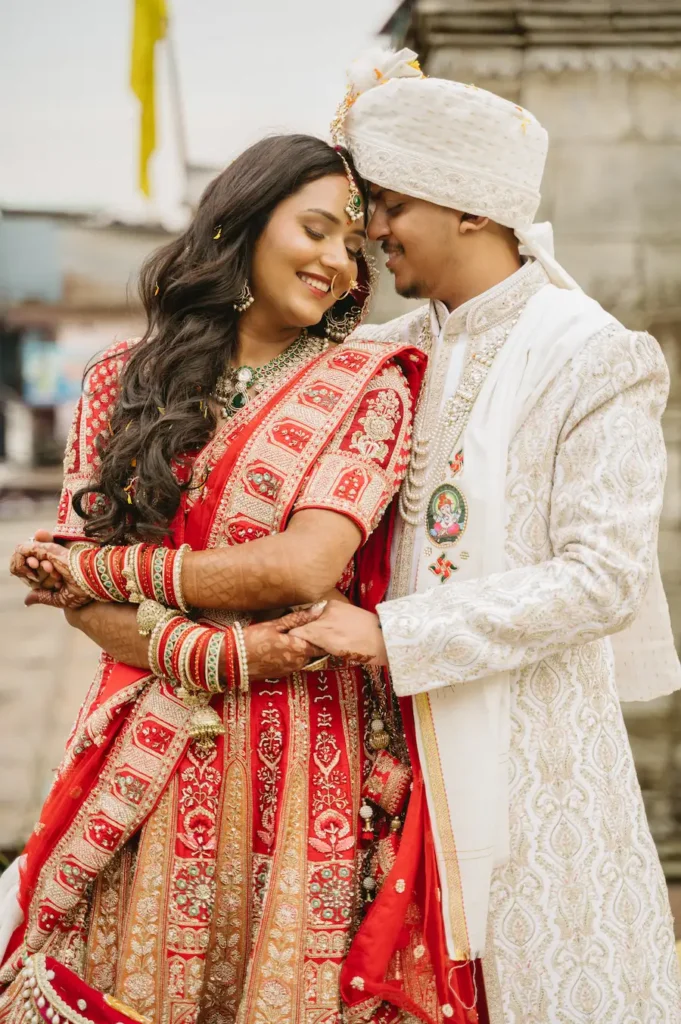 Romantic portrait of the bride and groom sharing an intimate wedding moment.