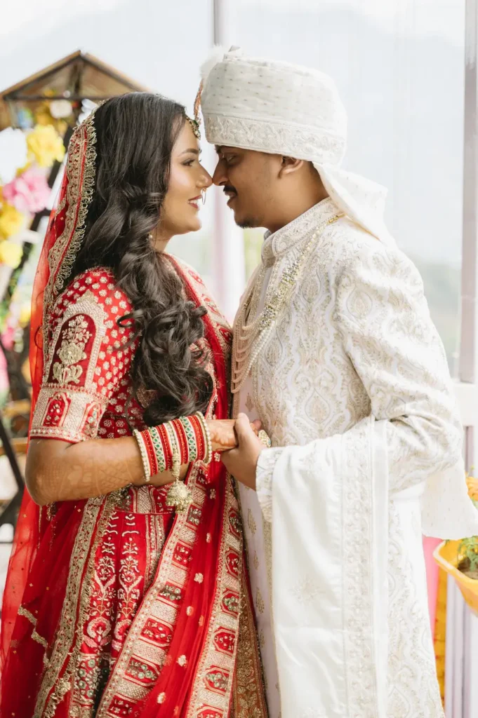 Bride and groom sharing a close and joyful moment during their wedding portrait session.
