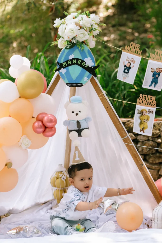 Baby Manraj wearing a first birthday party hat during his cake smash photoshoot