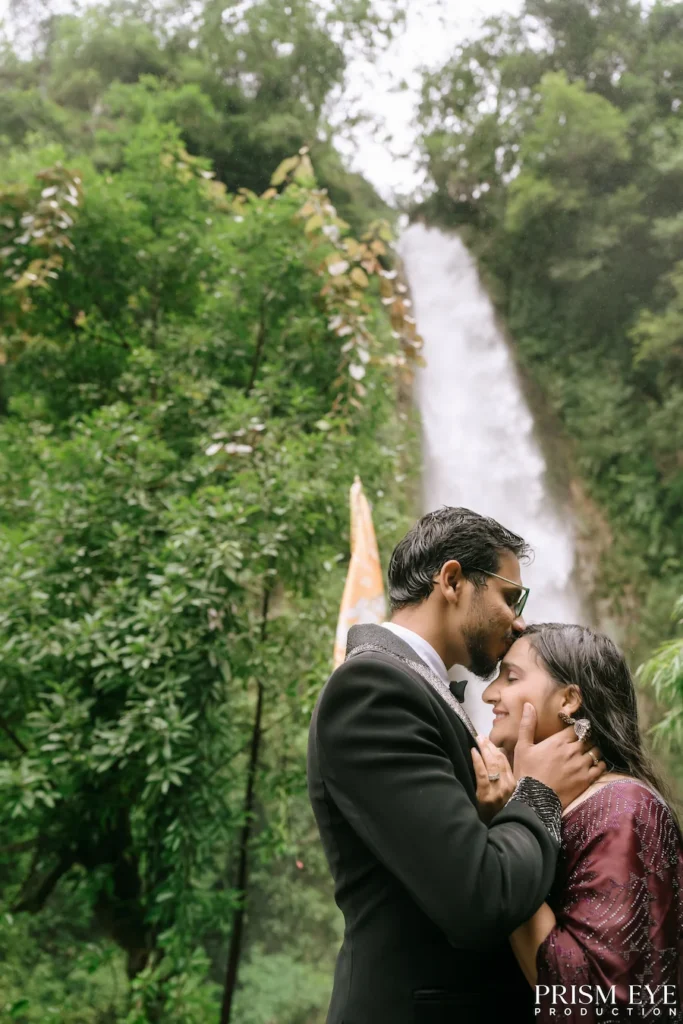 Couple sharing a romantic moment near Tiger Falls in Chakrata