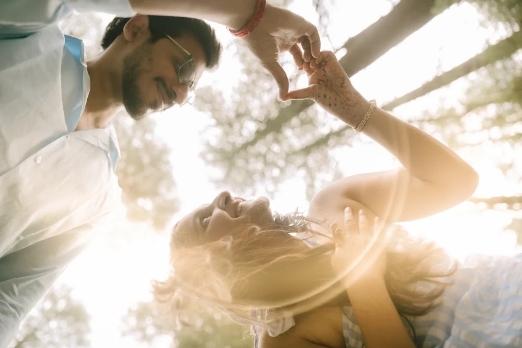 Couple sharing a playful moment during golden hour in Chakrata