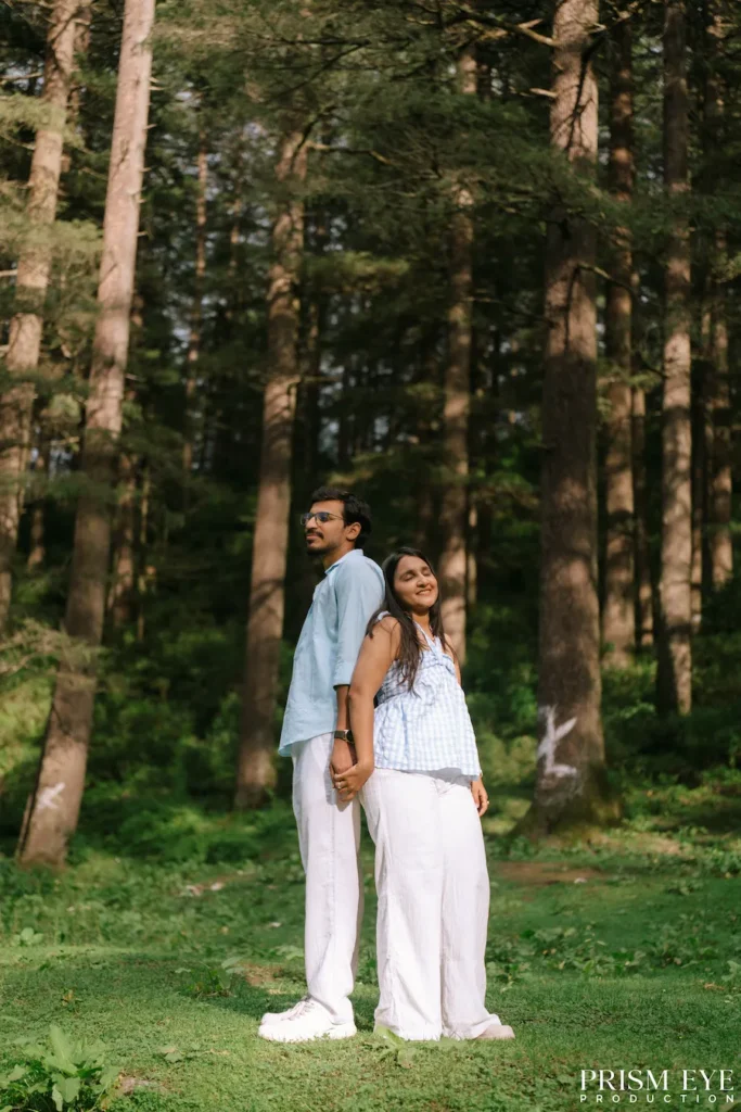 Couple standing together in a deodar forest in Deoband, Chakrata
