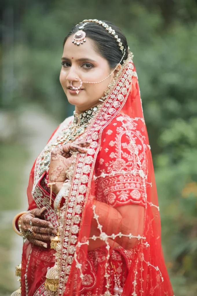 Destination Wedding in Char Machan Resort Guptkashi featuring a bride in a traditional red bridal lehenga