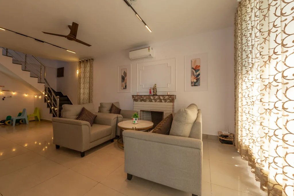 Spacious luxury holiday home living room with modern seating in Mussoorie, Uttarakhand.